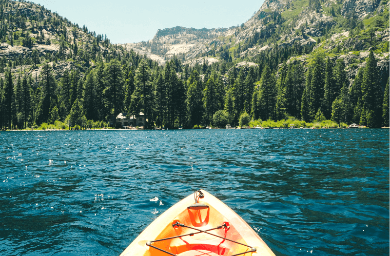 Kayaking in Lake Tahoe surrounded by mountains