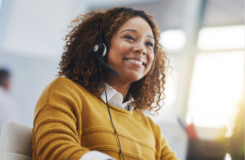 Woman travel Guide on the phone happily talking to a customer