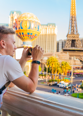 Person holding a cellphone in a balcony